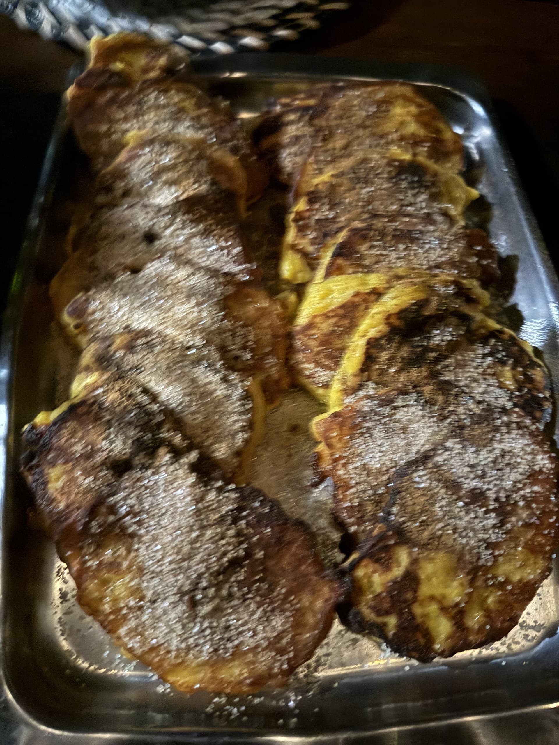 Freshly cooked French toast dusted with sugar served on a tray at Samonyana Private Island.