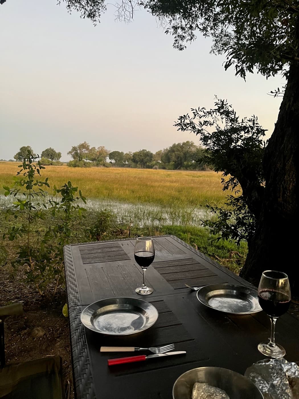 Dinner table set under the stars at Samonyana camp in the Okavango Delta