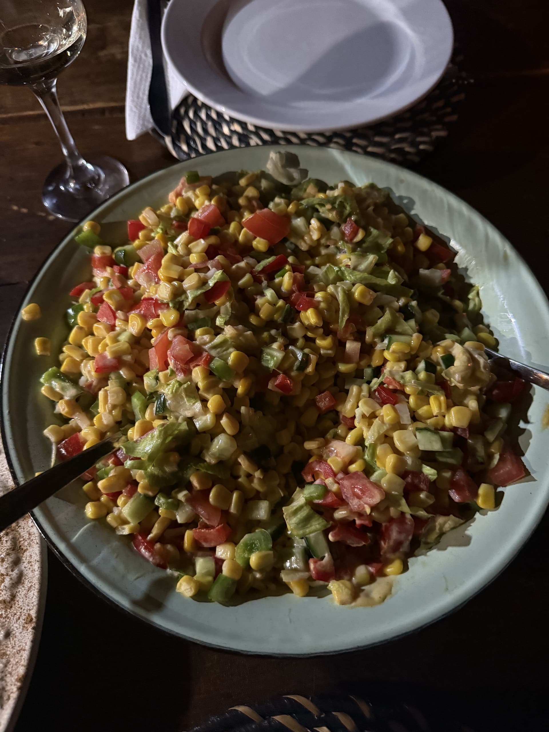 Fresh corn and tomato salad plated for dinner at the table at Samonyana Private Island.
