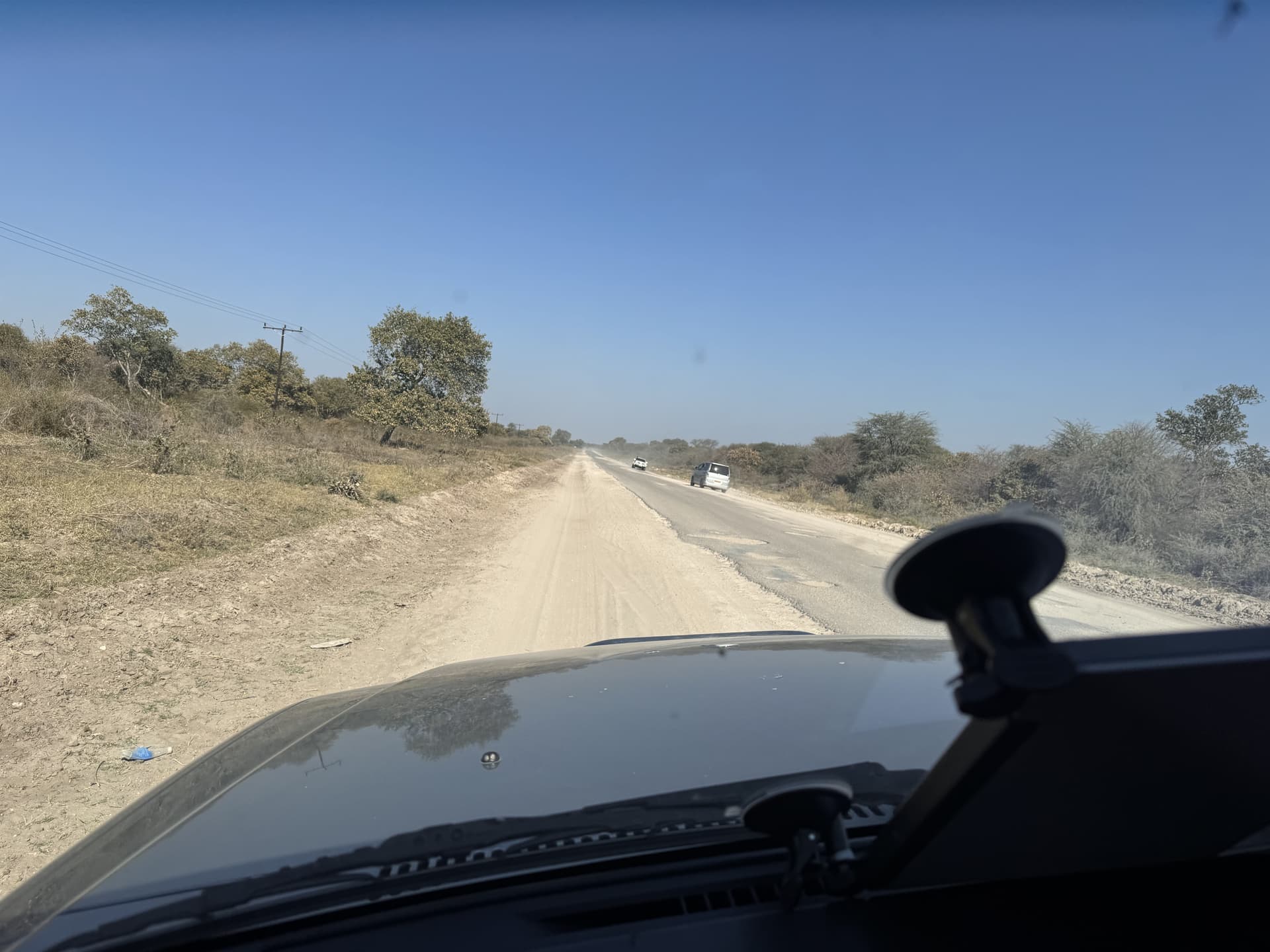 View of the gravel road ahead during the overland transfer to Samonyana in Botswana.
