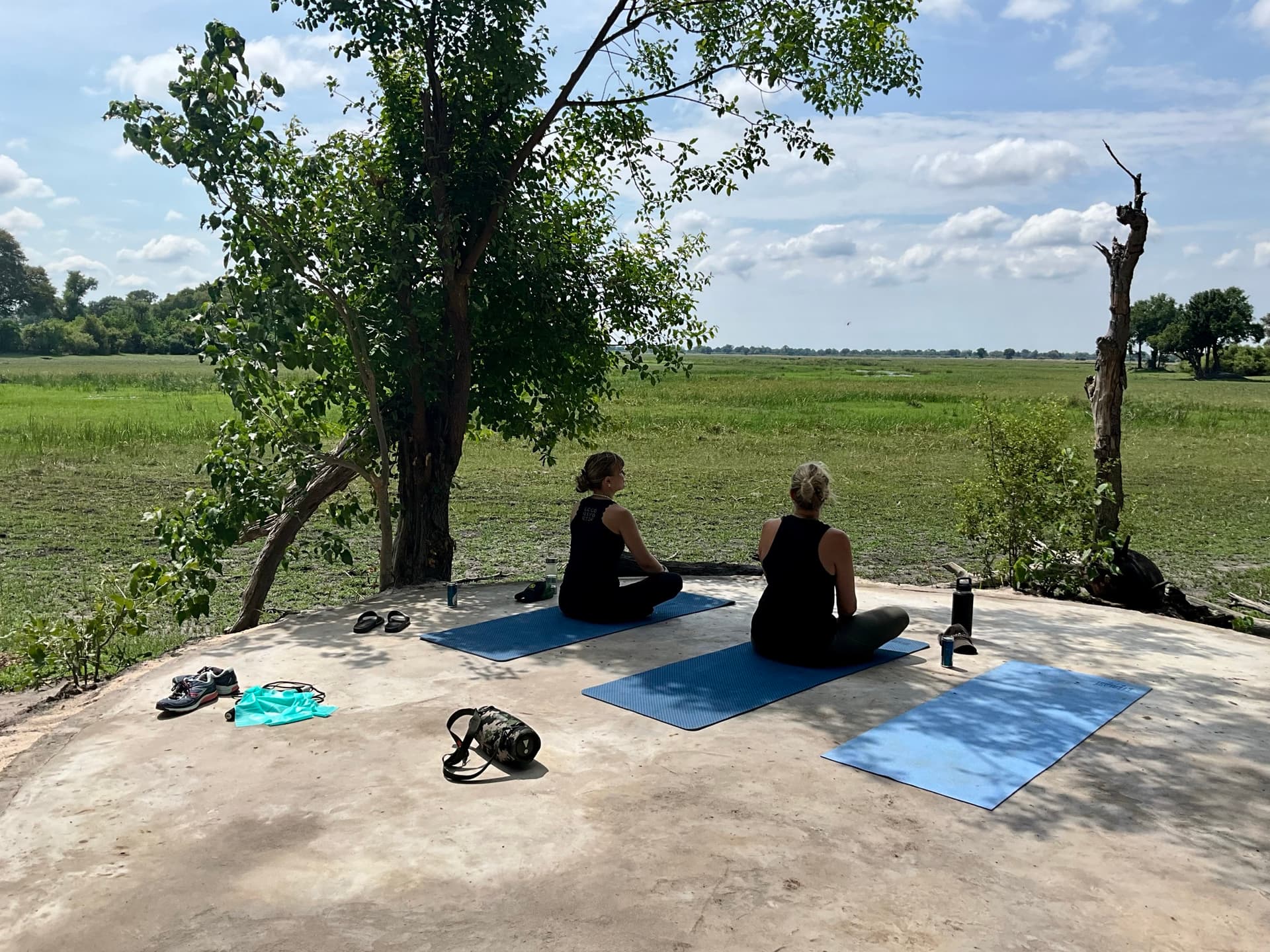 Morning yoga on the deck overlooking the Okavango Delta at Samonyana