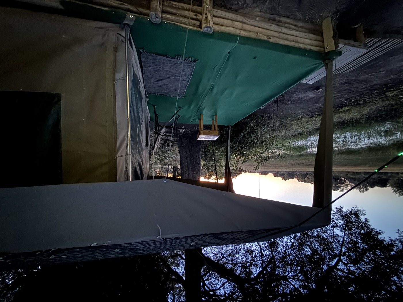 Safari tent at Samonyana Private Island overlooking the Okavango Delta floodplain at sunset