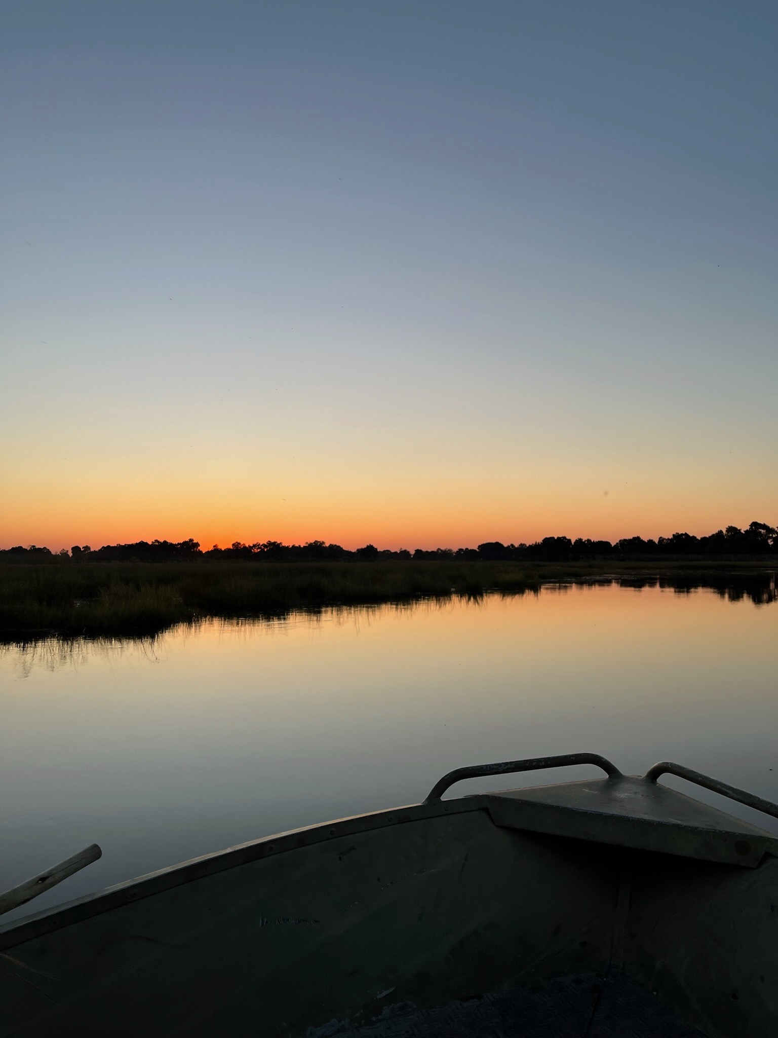 Glowing sunset reflected in the still delta waters